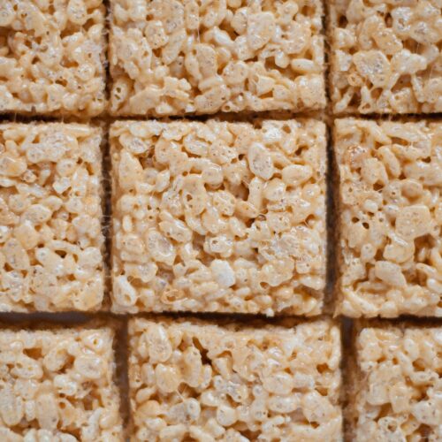 close up of squares of Peanut Butter Rice Krispie Treats cut and ready to eat.