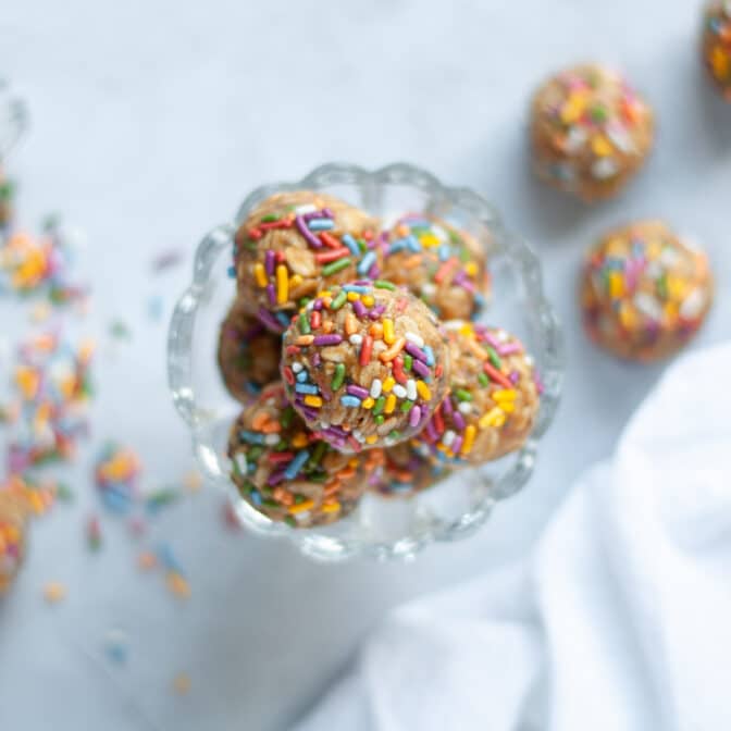 Top down view of a Small Glass Bowl of Birthday Cake Energy Bites