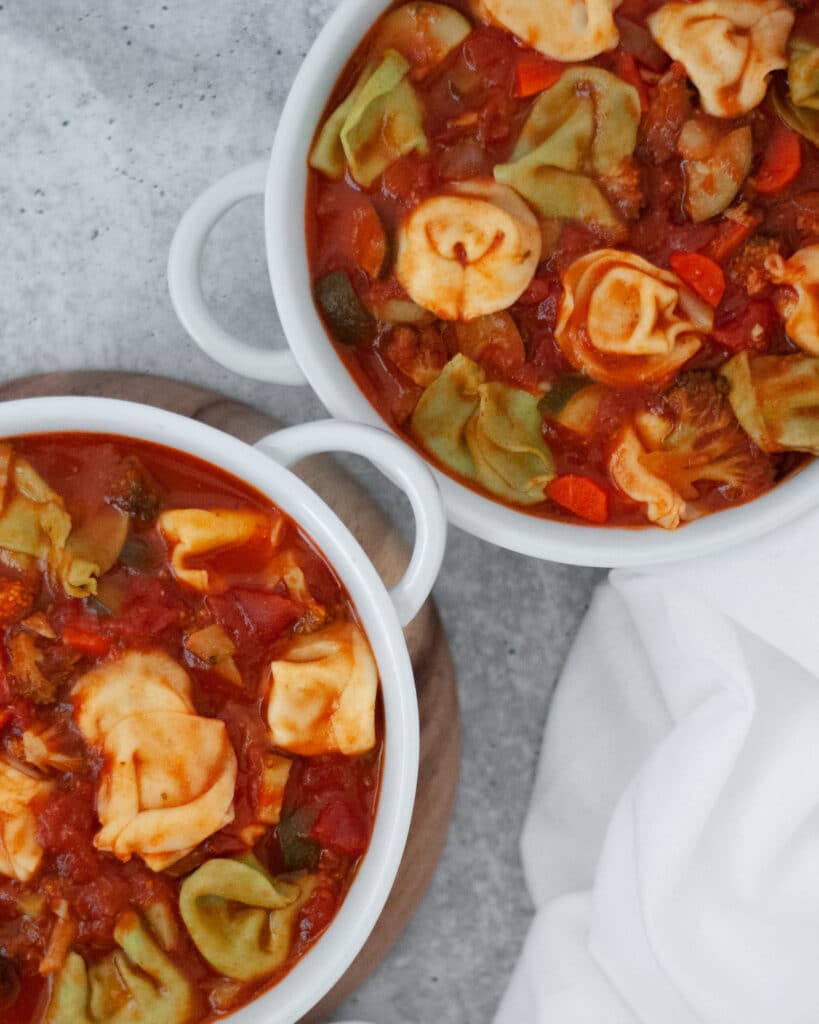 Top down view of two bowls of this tortellini soup