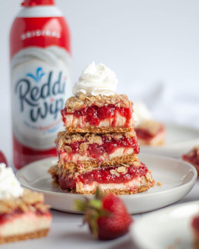 Reddi whip content creation by Our Love Language is Food. Strawberry-Rhubarb Cheesecake Bars