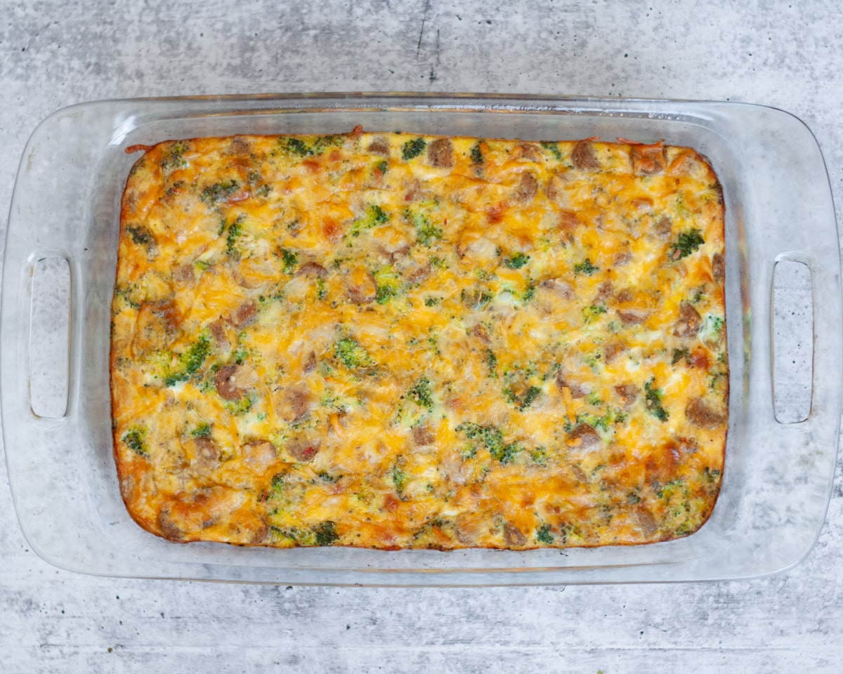 a 9x13 pan of cooked and ready broccoli cheese egg bake with sausage.