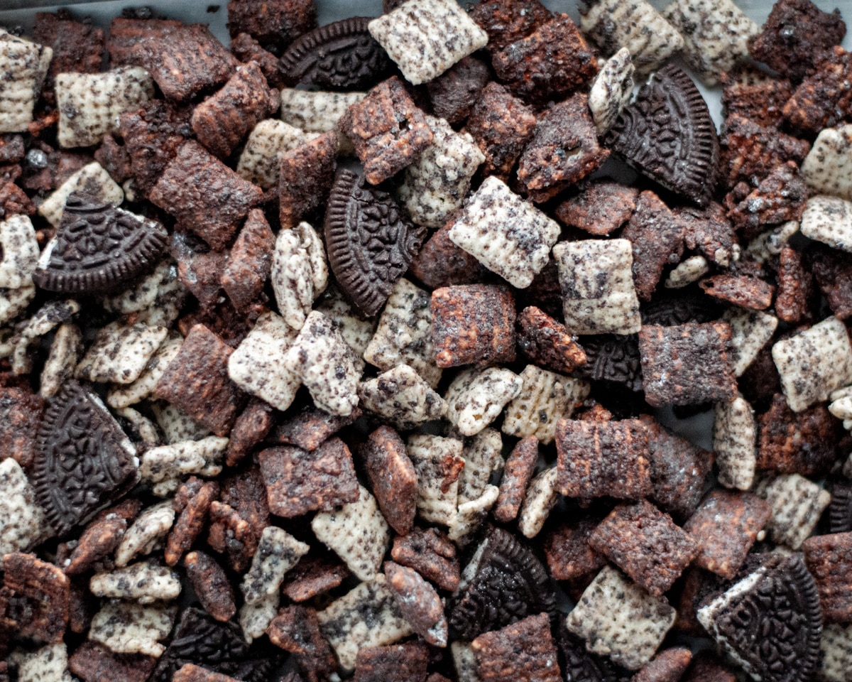 Close up for cookies and cream puppy chow with pieces of Oreo cookies in it.