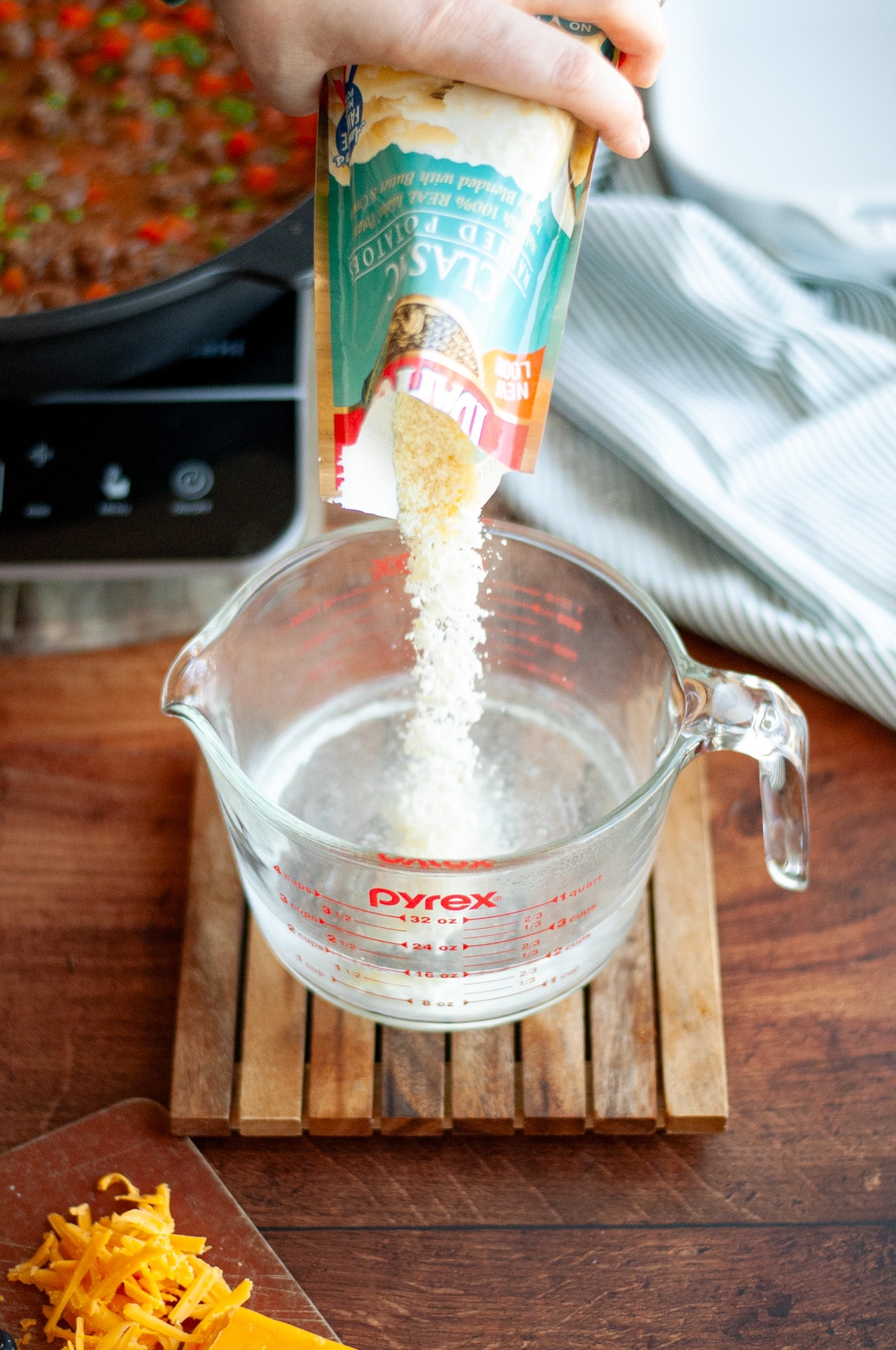 Process shot showing the instant mashed potatoes being made.