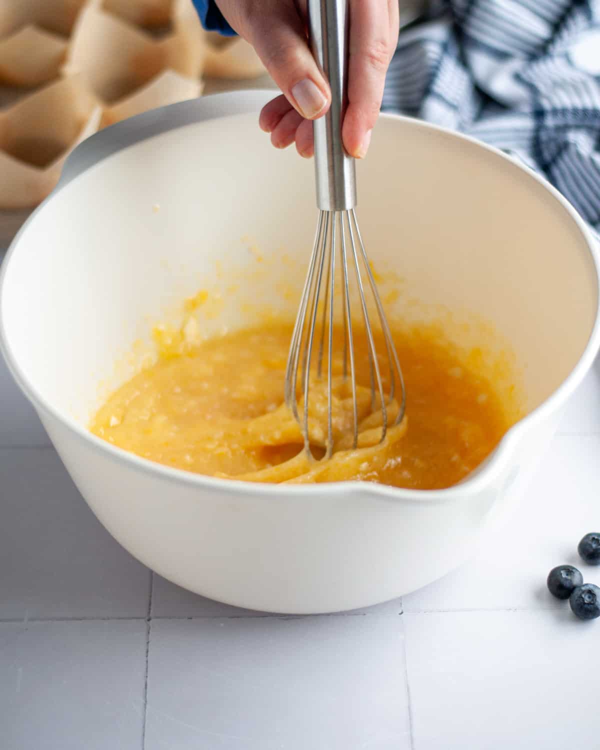 Process shot showing the wet ingredients being whisked together.