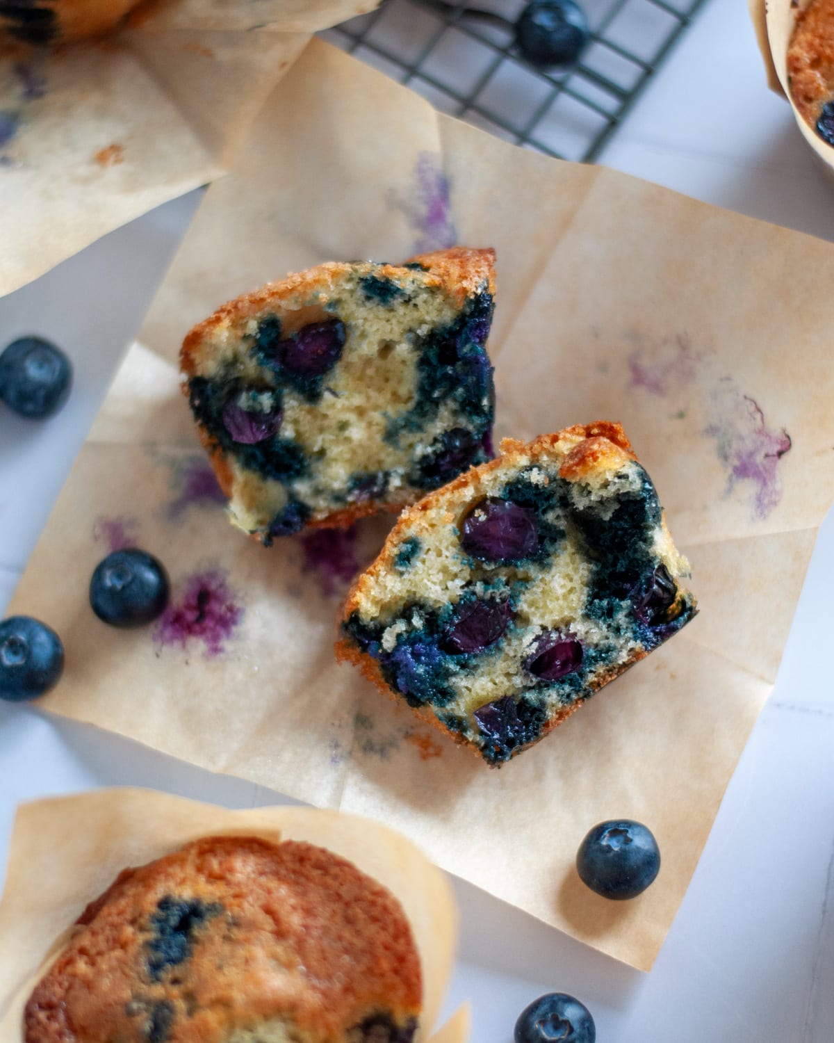 Top down view of the inside of a blueberry muffin.