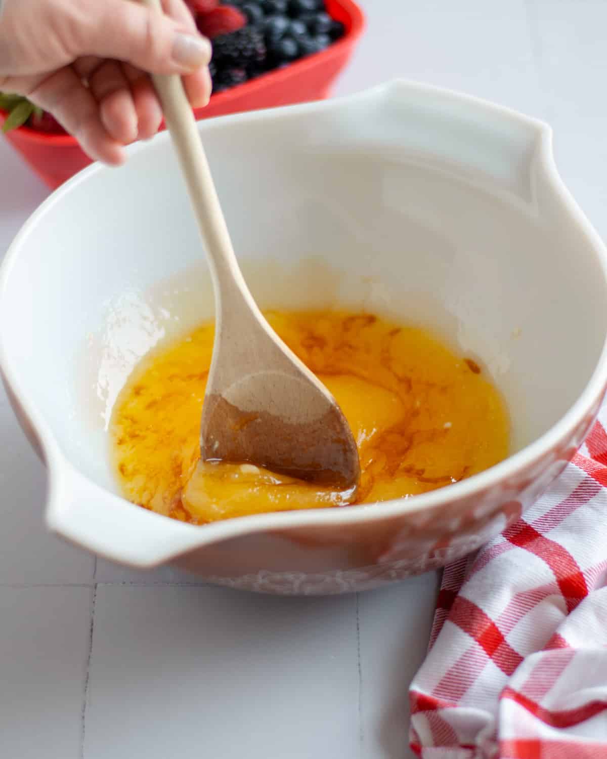 Process shot showing the crust wet ingredients and sugars being mixed together.