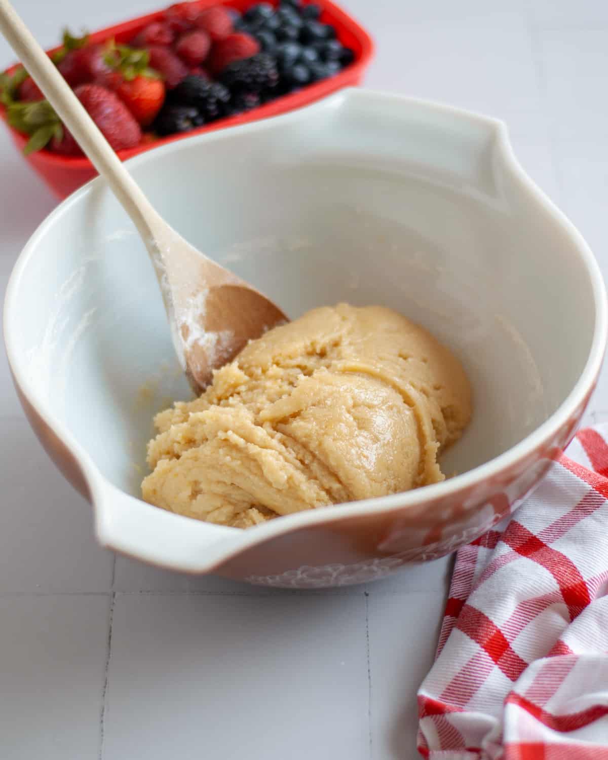 The sugar cookie crust dough formed in the mixing bowl.
