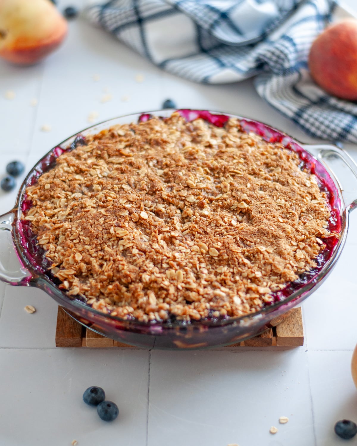 Process shot showing the baked blueberry peach crisp fresh out of the oven.