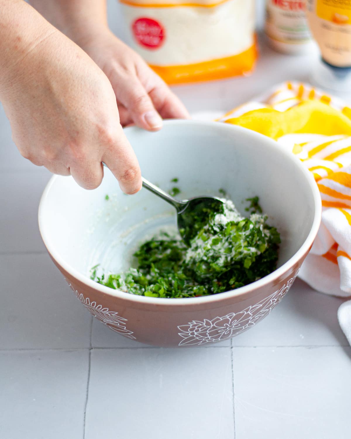 Process shot showing the dressing for corn salad being mixed together.