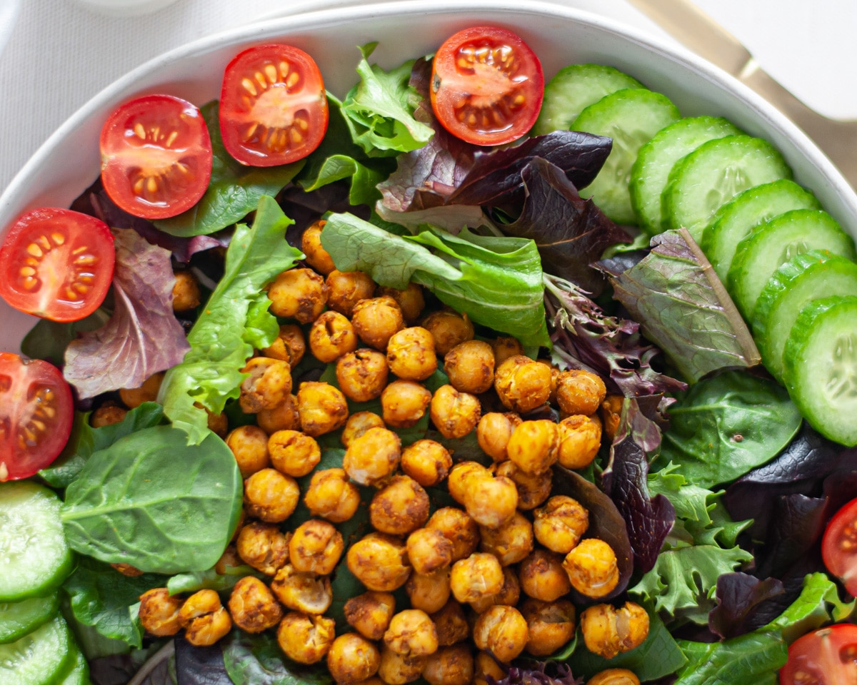 Top down view of a plate of curried chickpea salad.
