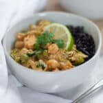 Close up of a bowl filled with our leftover chicken curry over forbidden rice.