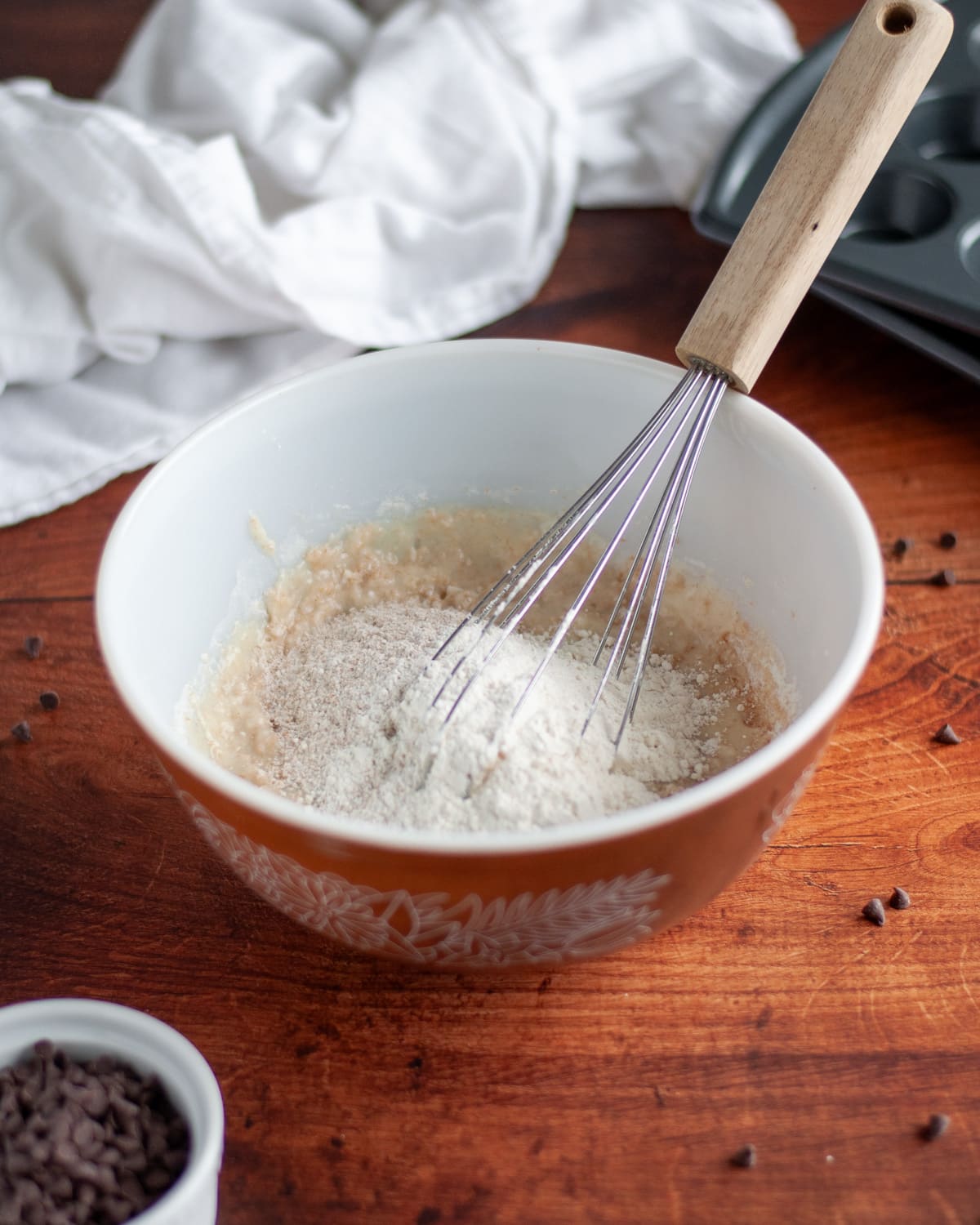 Process shot showing the flours being slowing incorporated into the wet ingredients.