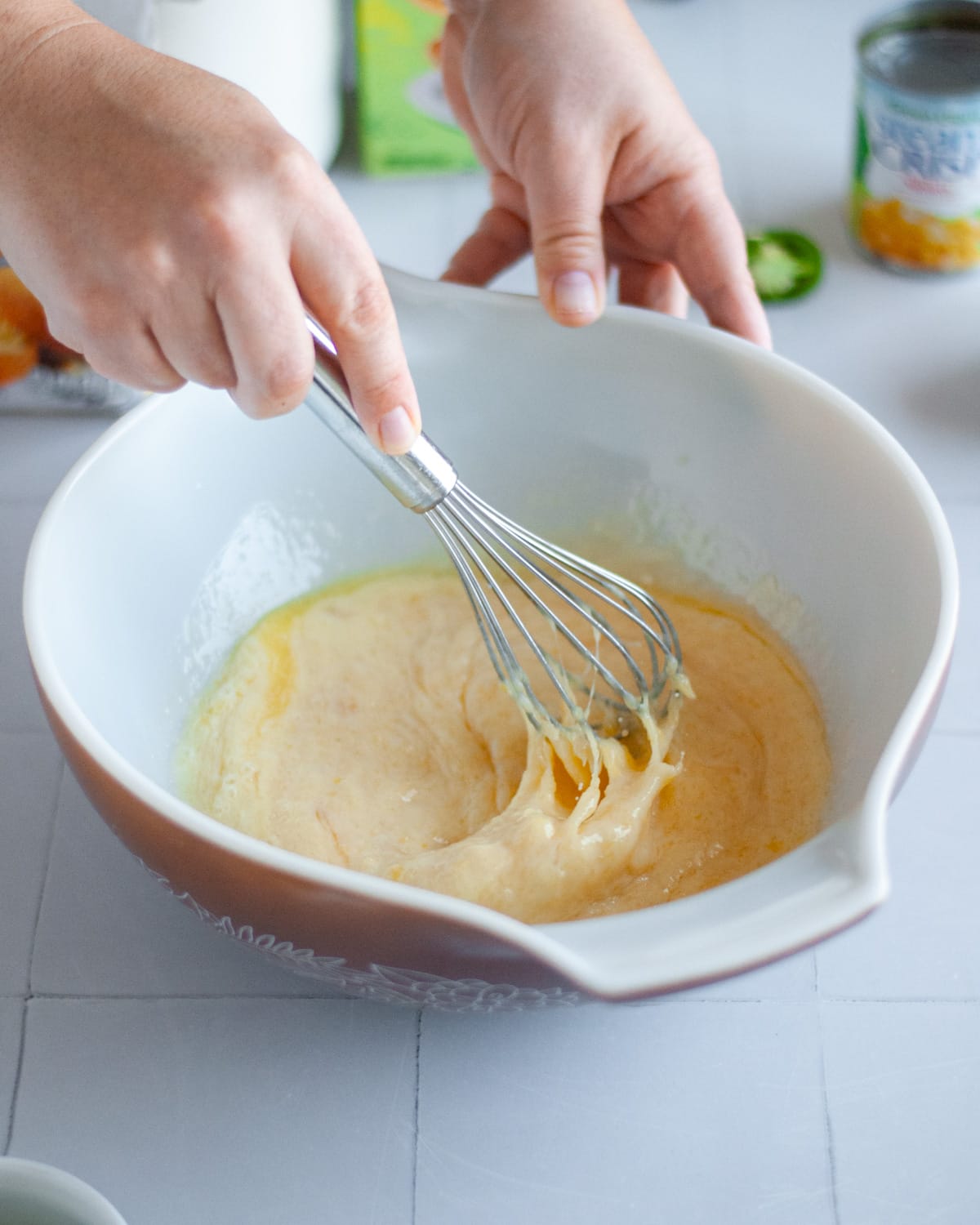 Process shot showing the wet ingredients being whisked together.