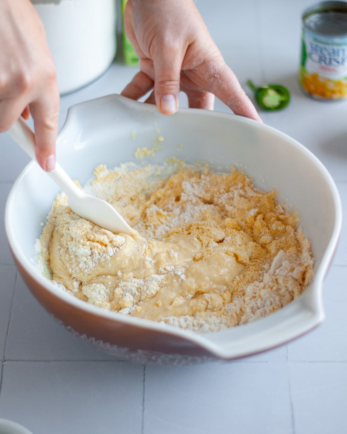 Process shot showing the wet ingredients being mixed into the liquid ingredients.