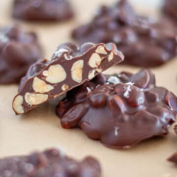 Feature image for our chocolate peanut clusters in a crockpot, showing off the inside of a cluster.